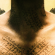 Illustration for article titled The Ancient Angel Language on Paul Bettanys Neck, Decoded